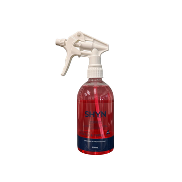 Red spray bottle with white nozzle labeled 'SHYN' on a white background