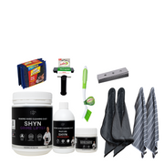 1KG shyn grime lifter, 3 pack of steel scrubs, 500ml shyn degreaser, 350g shyn paste, sabco long bristle brush, double sided scraper, 10 pack of blades, 2 shyn ultimate microfibre cloths, 2 shyn drying cloths
 